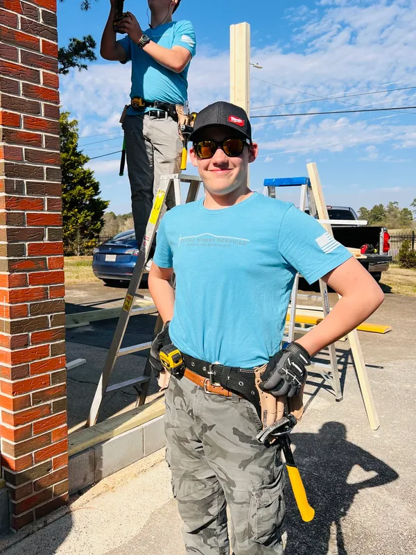 smile with ladder in background